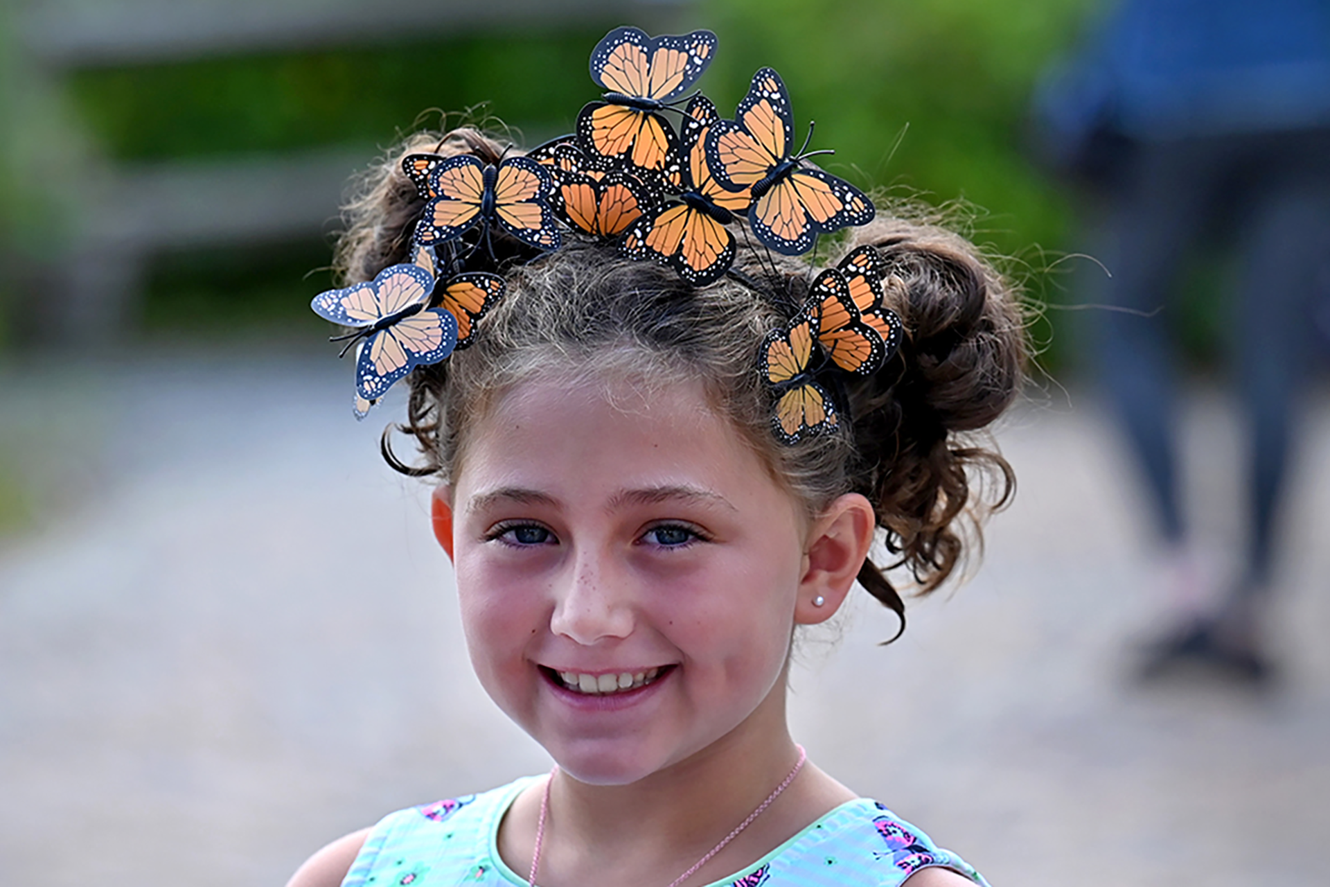Young girl wearing a monarch butterfly crown