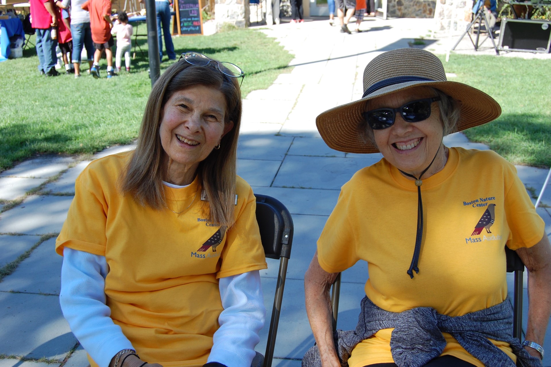 two people in yellow shirts