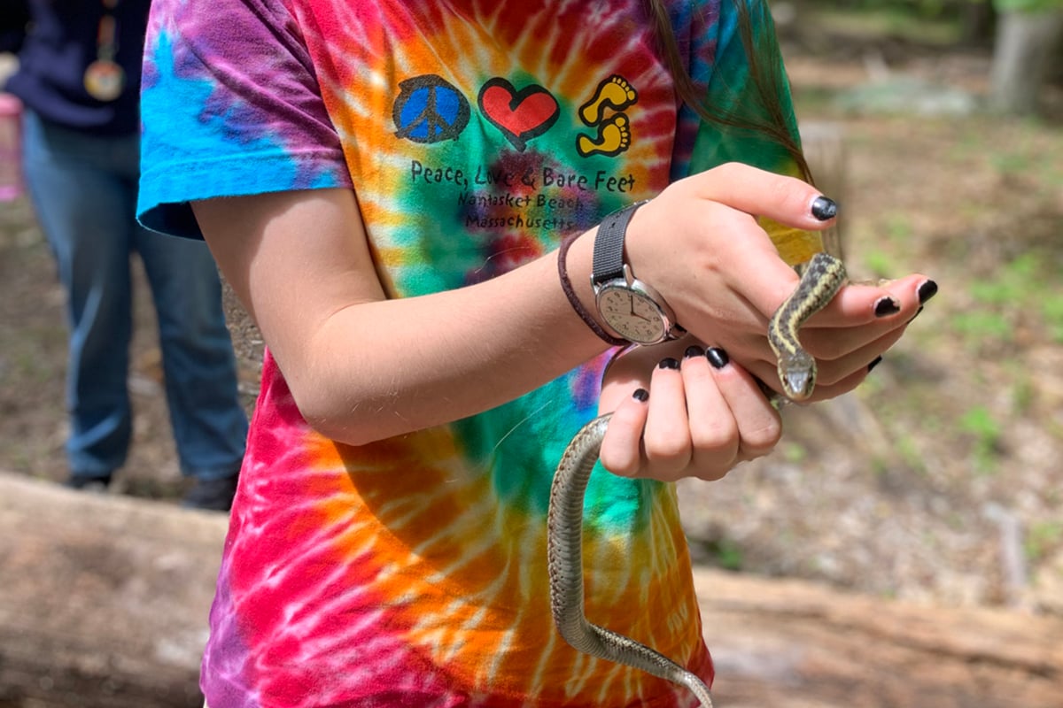 North River camper holding a snake