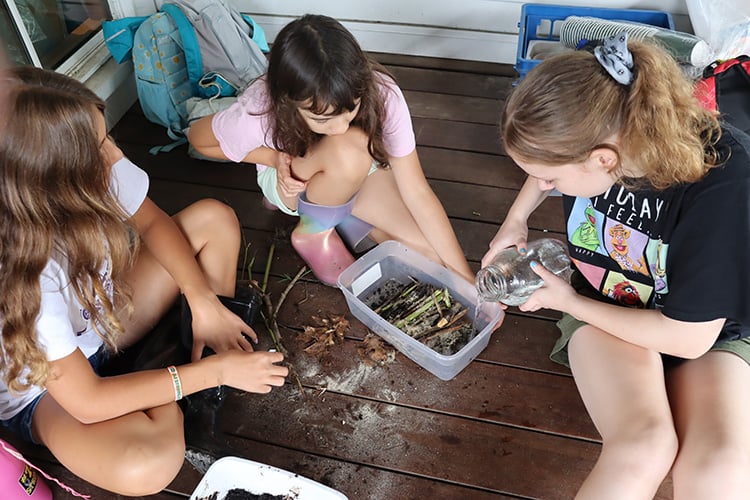 Older campers doing science experiement