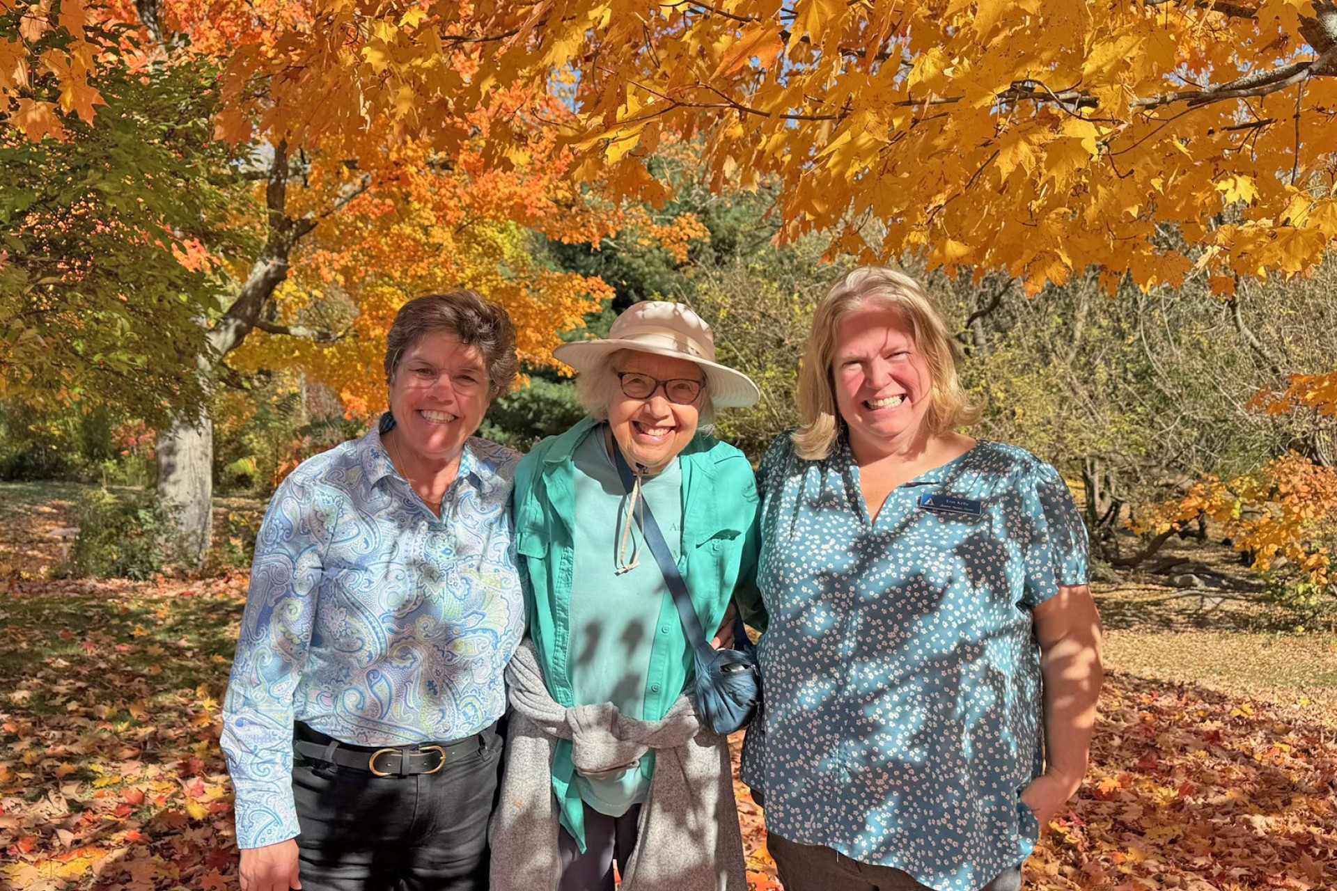 three people smiling